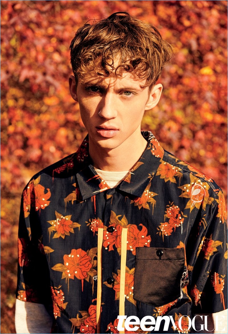 Ryan McGinley photographs Troye Sivan in a Coach shirt with a What Goes Around Comes Around sweatshirt.