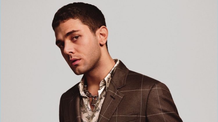 Xavier Dolan dons a windowpane print suit for Louis Vuitton's spring-summer 2017 campaign.