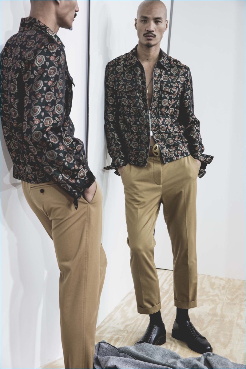 Model Paolo Roldan dons a patterned jacket with pleated cropped trousers by 3.1 Phillip Lim.