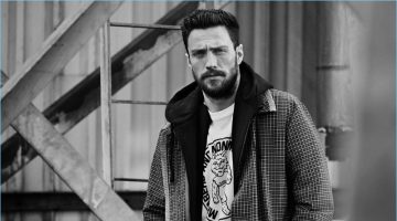 Aaron Taylor-Johnson Connects with Mr Porter, Talks Being a Feminist Aaron Taylor-Johnson sports a Prada checked wool coat with a Vetements + Champion hoodie and a Stella McCartney graphic t-shirt.