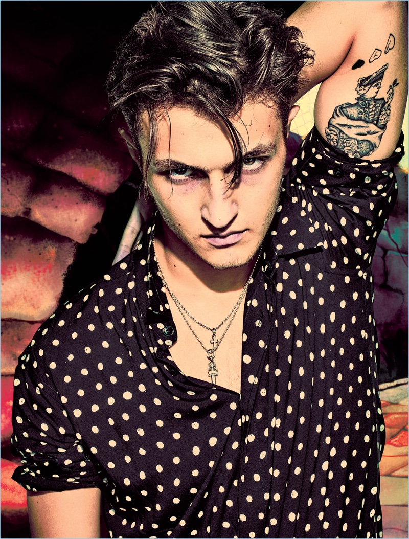 Anwar Hadid rocks a polka dot shirt from Saint Laurent.