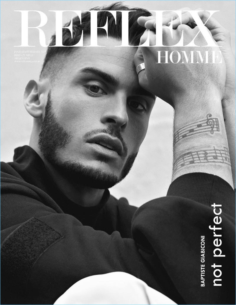 Appearing in a black and white image, Baptiste Giabiconi covers Reflex Homme.