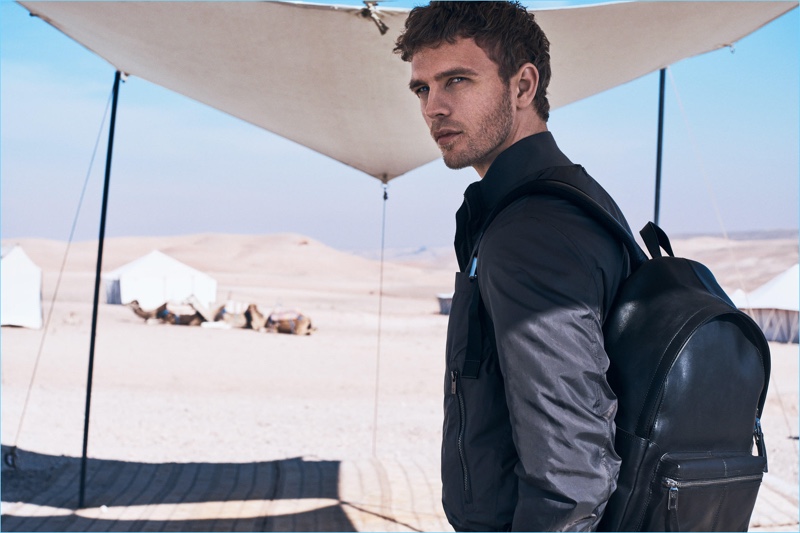 Accessorized for travel, Benjamin Eidem sports a leather backpack by Massimo Dutti.