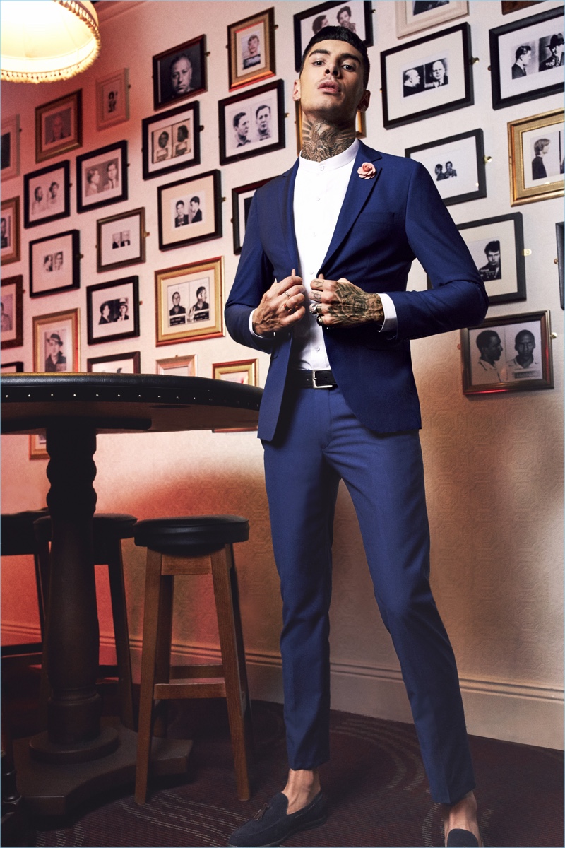 Savio De Chiara dons a trim blue suit from boohooMAN's new tailoring collection.