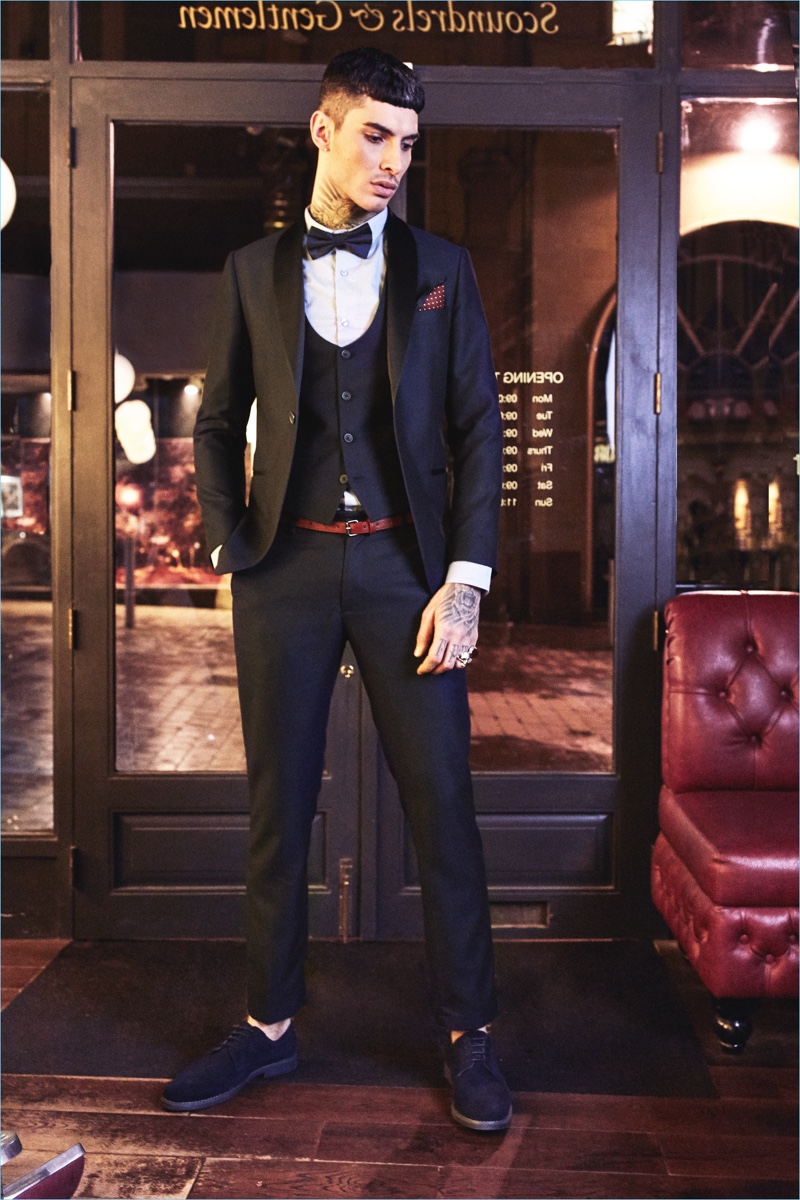 Embracing a dapper image, Savio De Chiara wears a waistcoat and suit by boohooMAN.