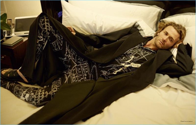 Relaxing in bed, Brad Kroenig dons a look from Dolce & Gabbana.