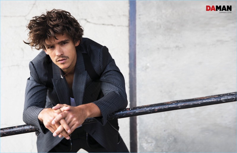 Relaxing, Brenton Thwaites dons a look from Givenchy for Da Man.
