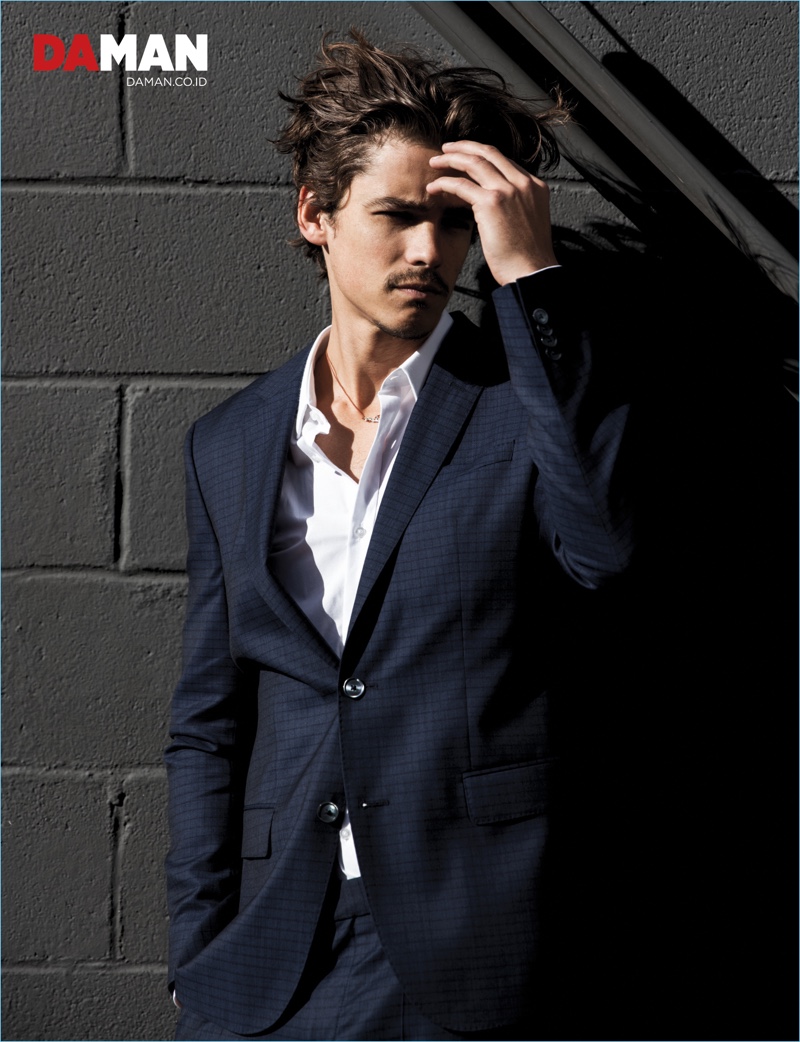 Appearing in a photo shoot for Da Man, Brenton Thwaites wears Hugo Boss.