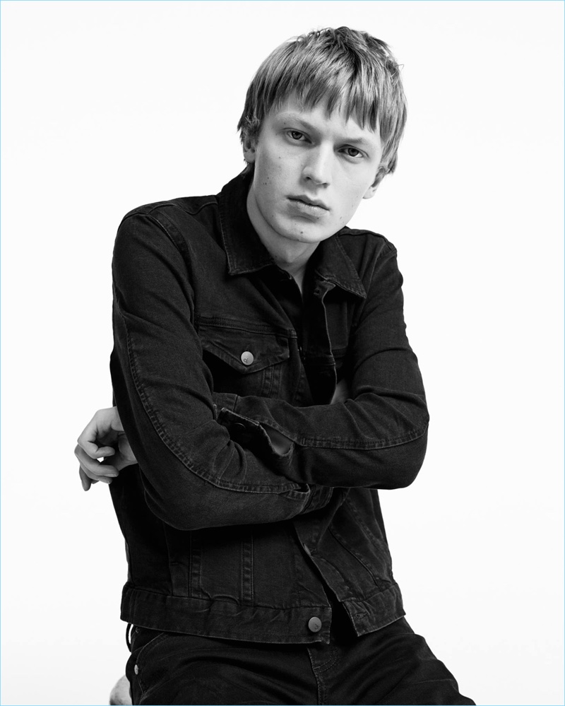 Jonas Gloer rocks a black denim jacket and jeans for Calvin Klein Jeans' spring-summer 2017 campaign.