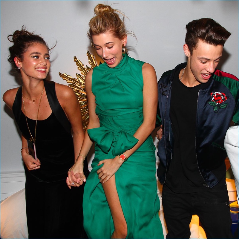 Cameron Dallas parties with his 212 VIP campaign co-stars, Taylor Hill and Hailey Baldwin. 
