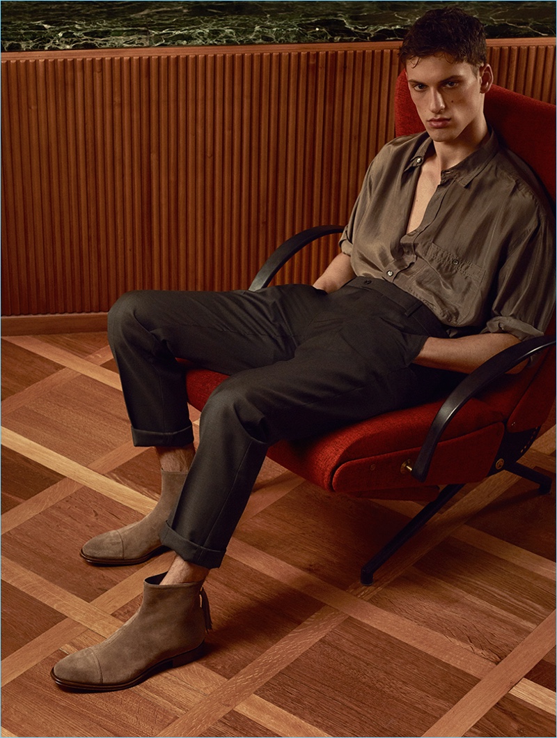 Starring in Cesare Paciotti's spring-summer 2017 campaign, David Trulik dons suede boots.