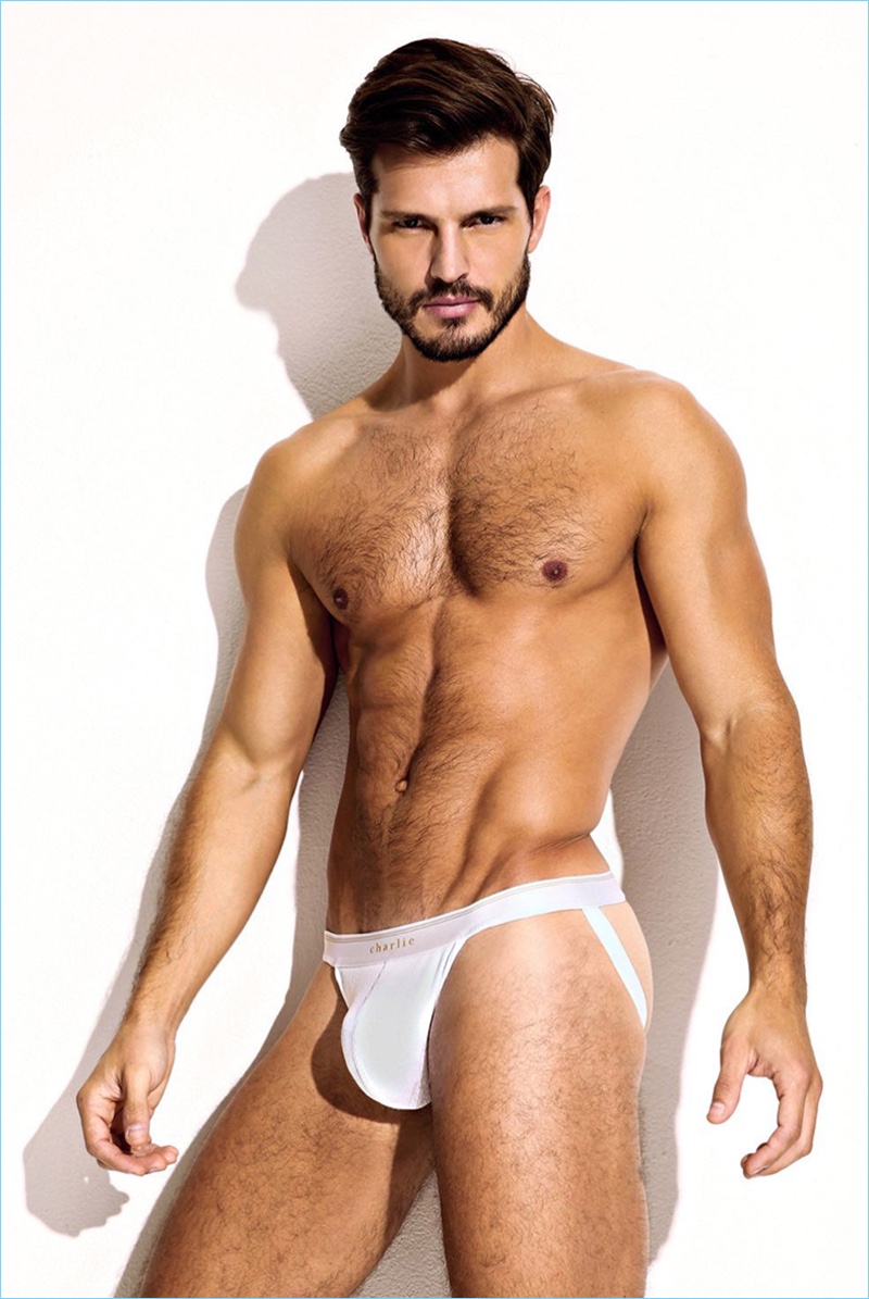 Brazilian model Diego Miguel dons a white jock strap from Charlie by Matthew Zink.
