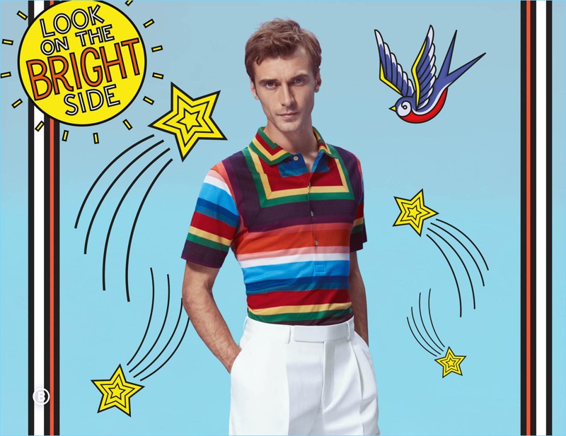 Clément Chabernaud dons a colorful polo and white trousers by Paul Smith.