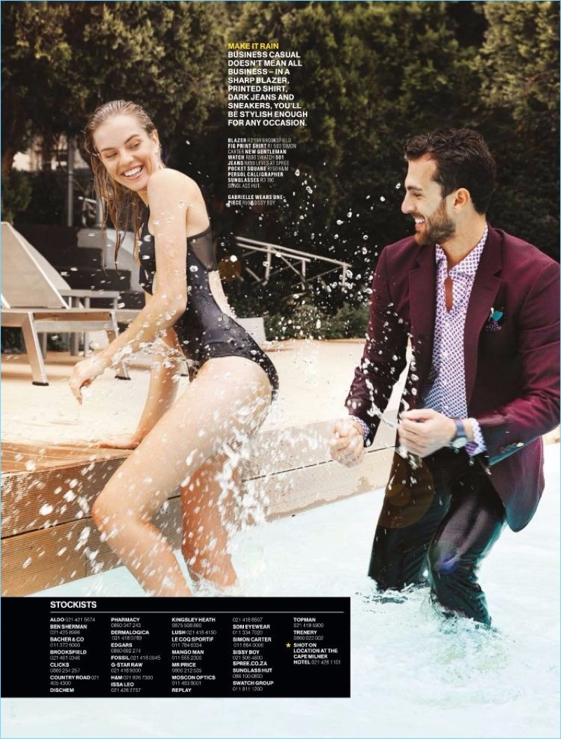 Having fun in the pool, Clint Mauro dons a Brooksfield blazer, Simon Carter shirt, and Levi's jeans.