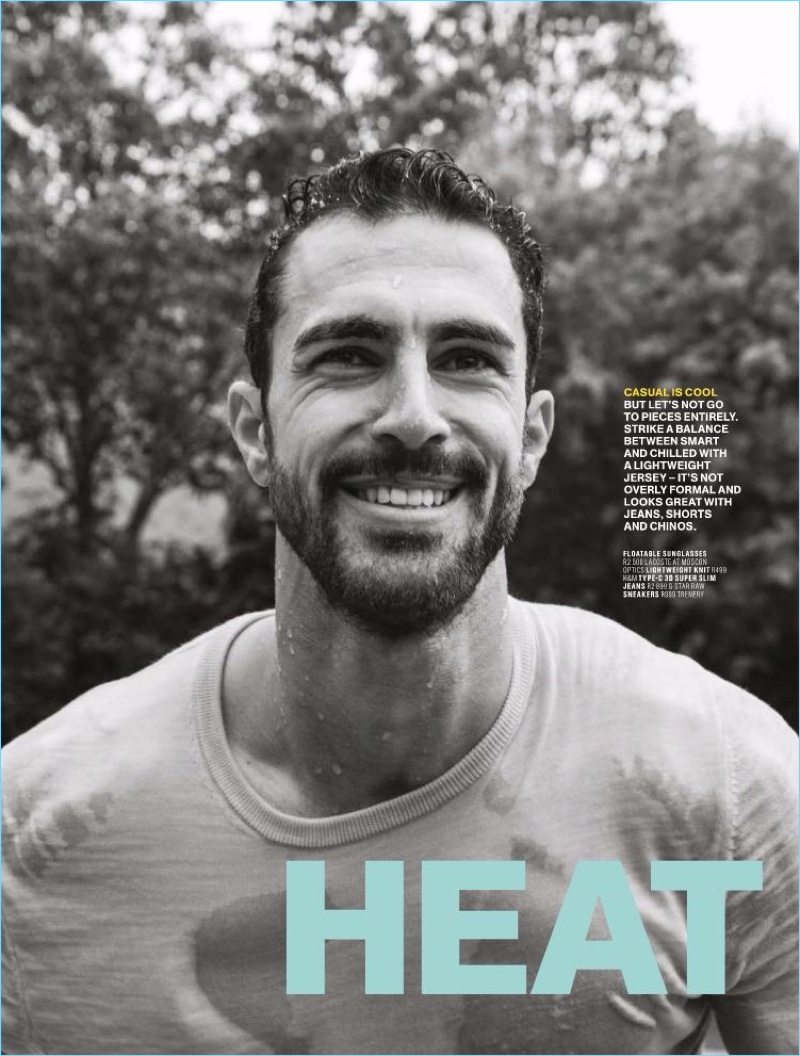 All smiles, Clint Mauro wears a H&M knit for the pages of Men's Health.
