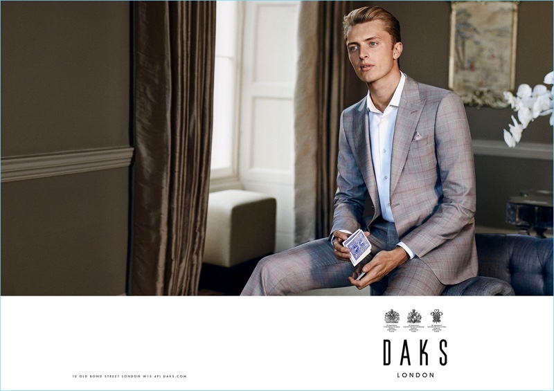 Max Rendell dons a check grey suit for Daks' spring-summer 2017 campaign.