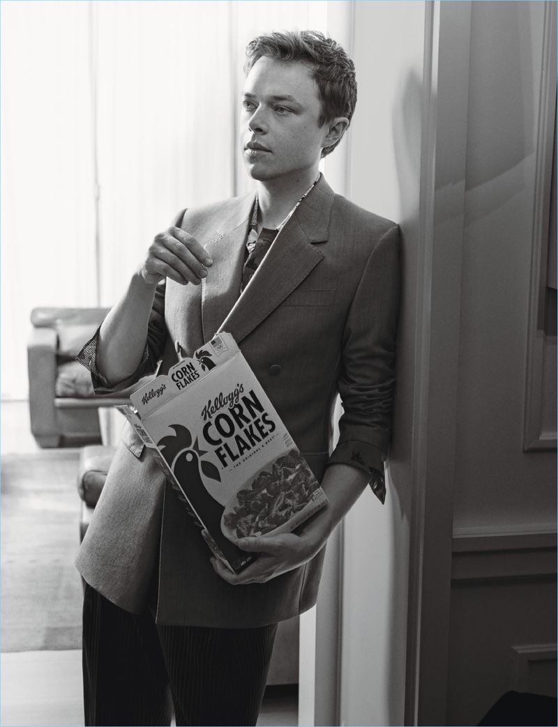 Enjoying a box of Corn Flakes, Dane DeHaan wears a Cerruti 1881 sport coat with a Jeffrey Rüdes shirt and Lanvin trousers.