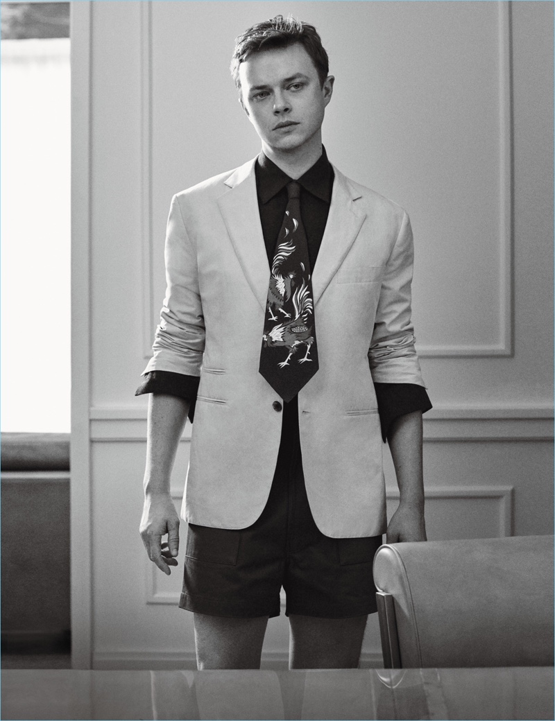 Craig McDean photographs Dane DeHaan in a Hermes blazer and shirt with E.Tautz shorts.