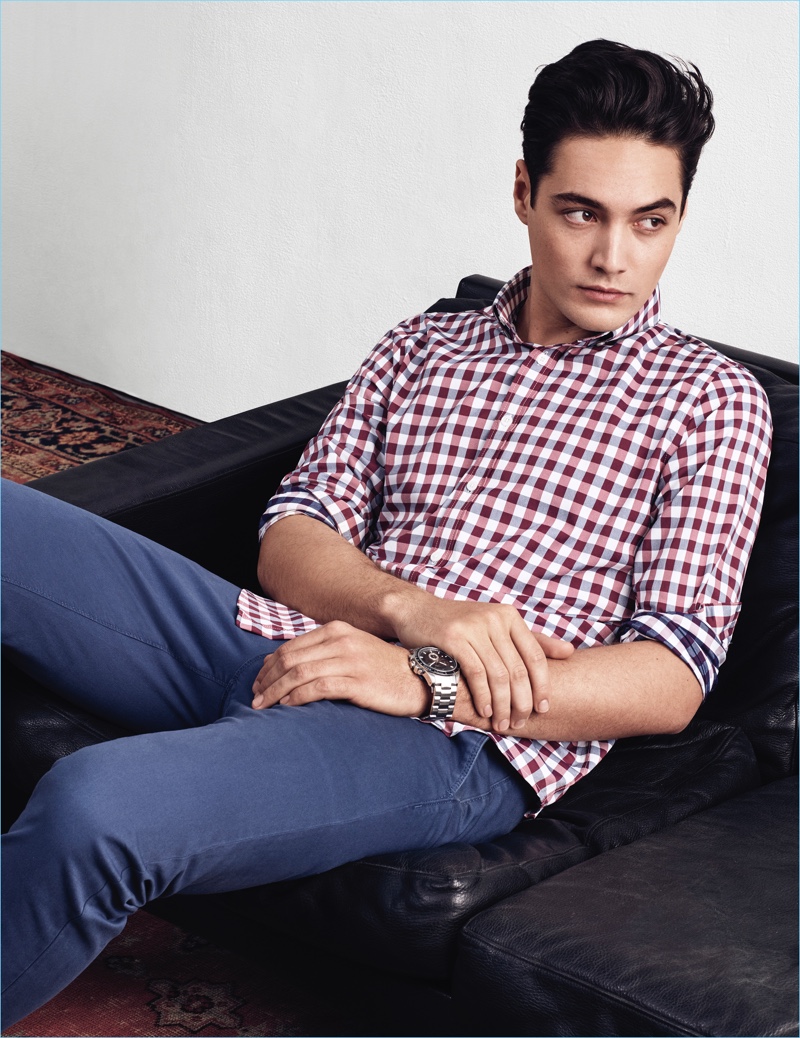 Going casual with Express, Levi Dylan wears a check shirt with slim-fit pants.