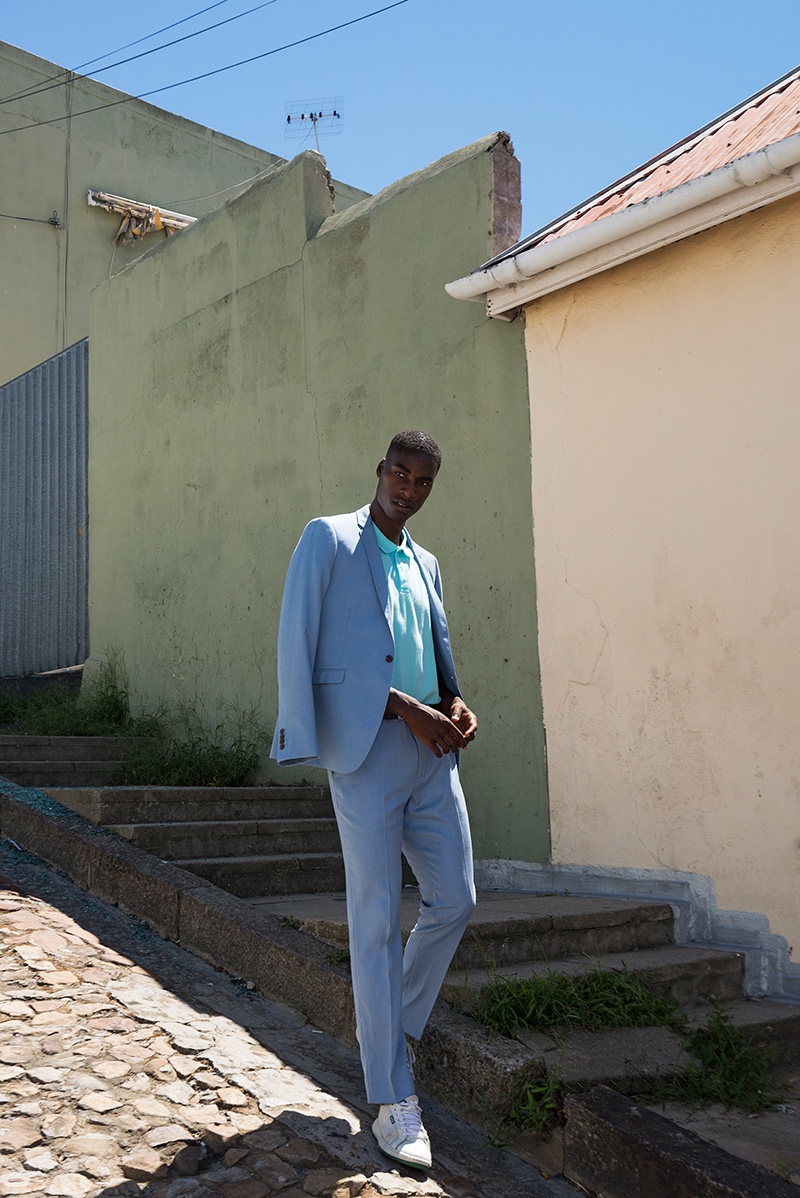 Gauderic wears suit Ben Sherman, polo River Island, and shoes Prince.