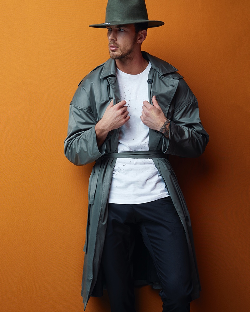 Christian wears parka Martine Rose, t-shirt Issey Miyake, pants Jil Sander, and vintage hat stylist's own.