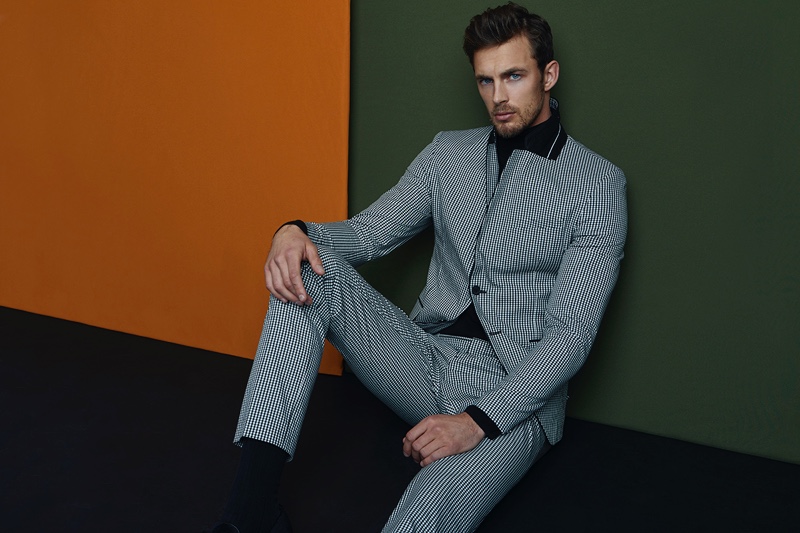 Christian wears check suit Tiger of Sweden, turtleneck Rick Owens, and shoes Hudson.