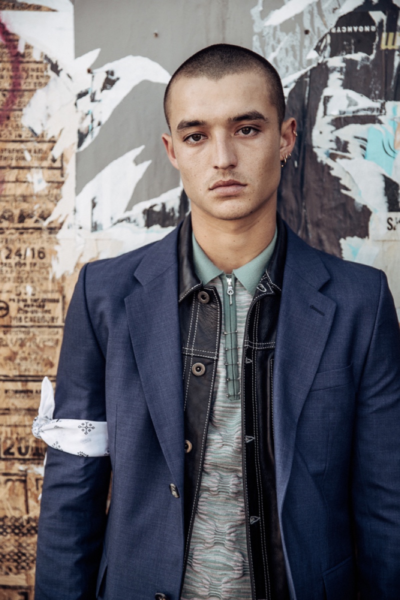 Kaleb wears polo Orley, leather jacket Diesel Black Gold, bandana stylist's own, and sport coat Éditions MR.