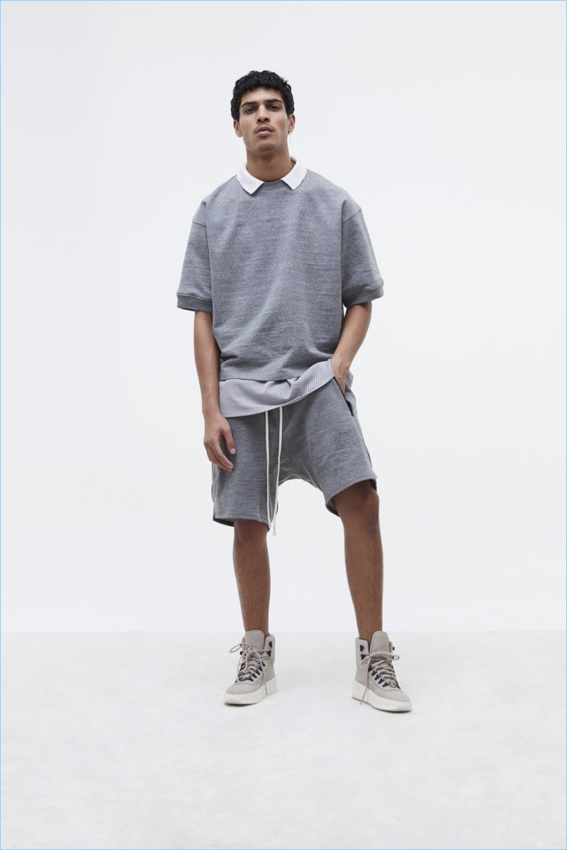 Fear of God goes casual for fall with a grey gym-inspired number. The look features a short-sleeve sweatshirt and sweat shorts.