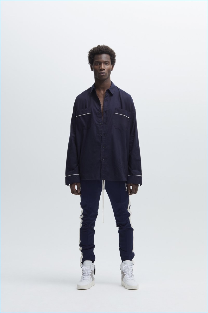 Model Adonis Bosso wears a pajama-inspired top with joggers and sneakers from Fear of God.