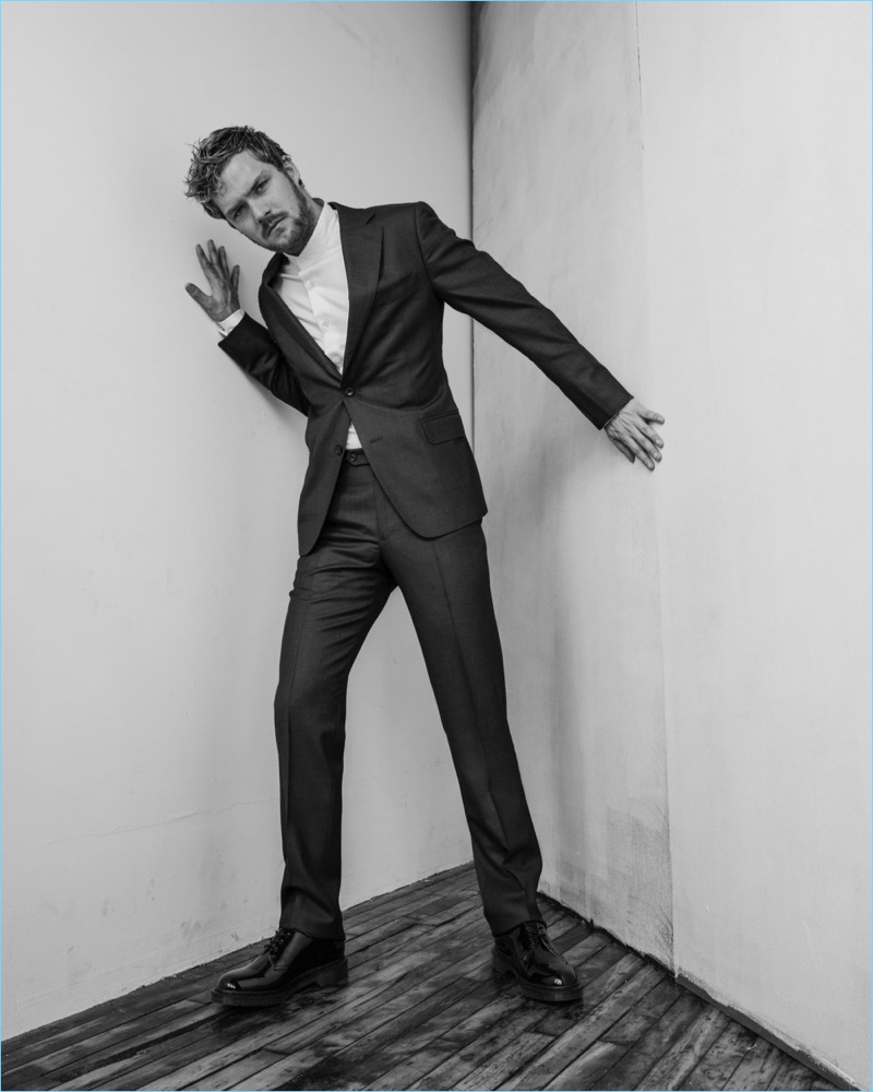 Finn Jones wears a J.Hilburn suit with a Stephen F shirt and Dr Martens shoes.