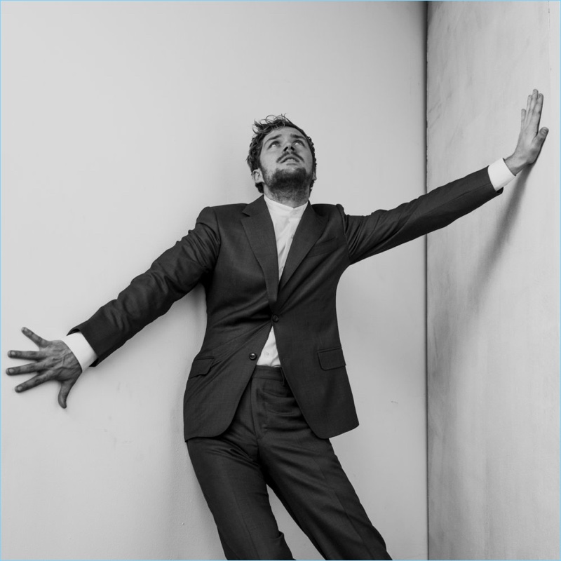 Donning a J.Hilburn suit, Finn Jones makes a dramatic pose for The Laterals.