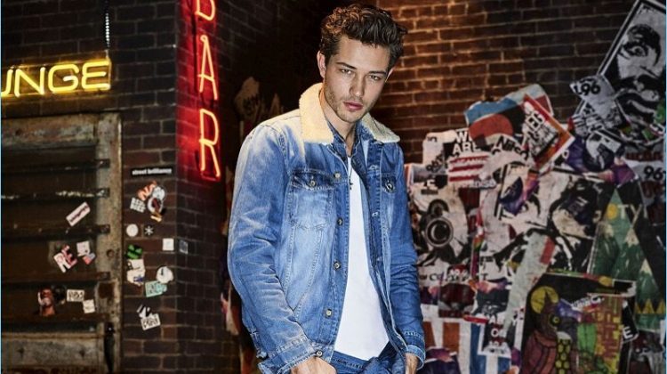 Francisco Lachowski wears double denim for Colcci's fall-winter 2017 campaign.