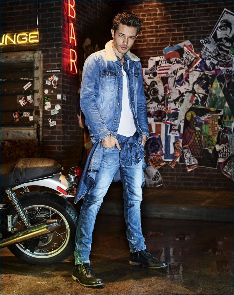 Francisco Lachowski wears double denim for Colcci's fall-winter 2017 campaign.