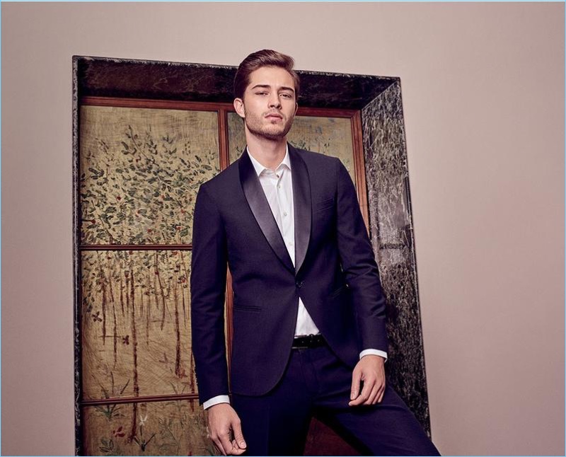 Dressed to impress, Francisco Lachowski wears a sharp tuxedo jacket with a crisp white shirt.