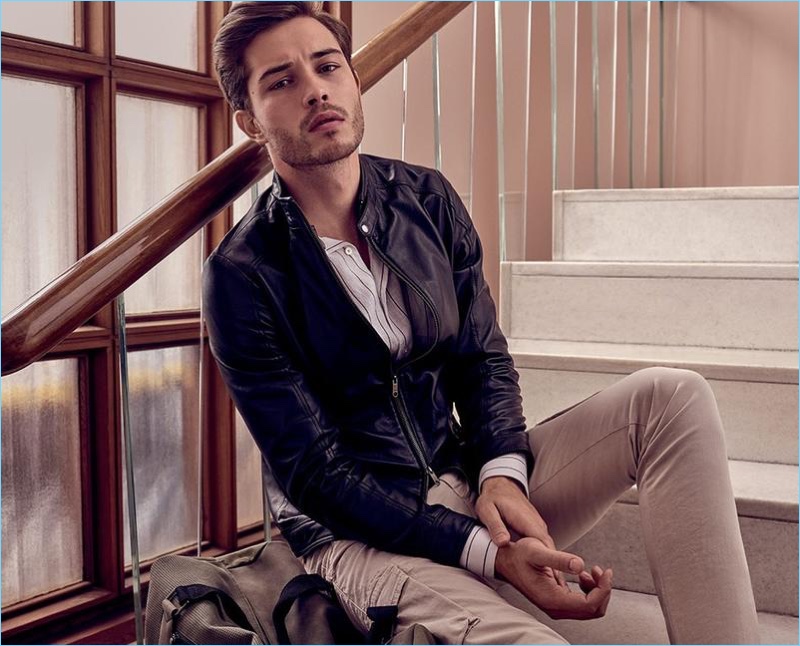 Delivering his best angles, Francisco Lachowski sports a leather jacket with slim-fit cargo pants.
