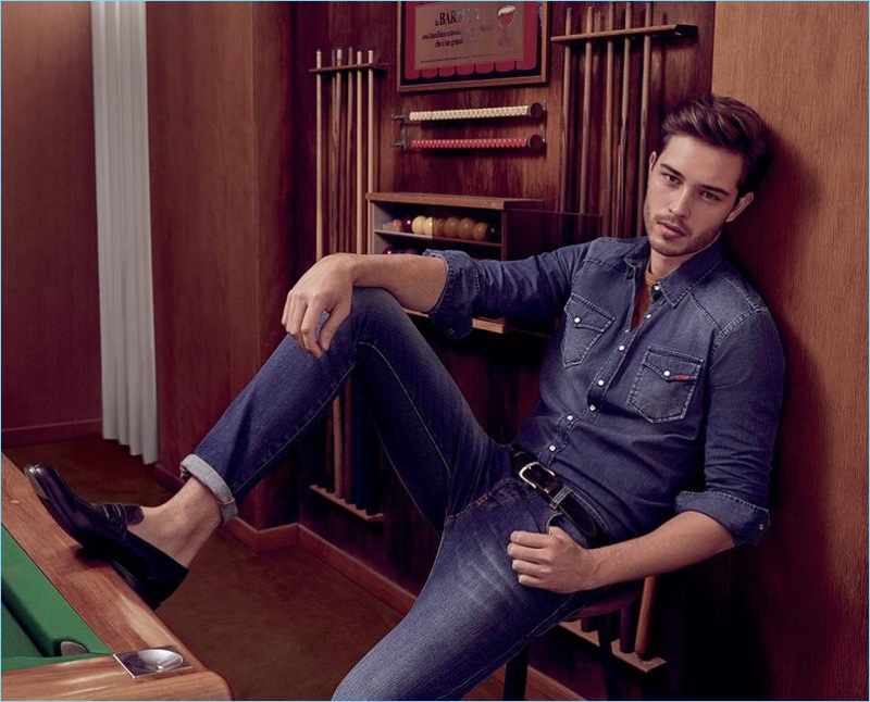 Connecting with Liu Jo, Francisco Lachowski wears a distressed denim shirt and slim-fit jeans.