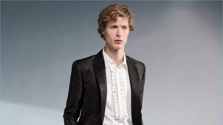 Sven de Vries wears an elegant tuxedo, ruffled shirt, and cummerbund from H&M's Conscious Exclusive collection.