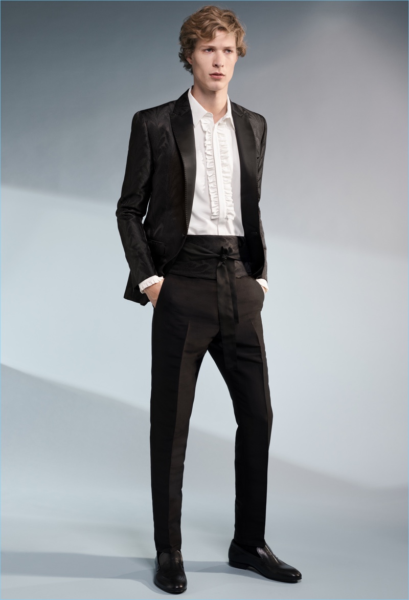 Sven de Vries wears an elegant tuxedo, ruffled shirt, and cummerbund from H&M's Conscious Exclusive collection.