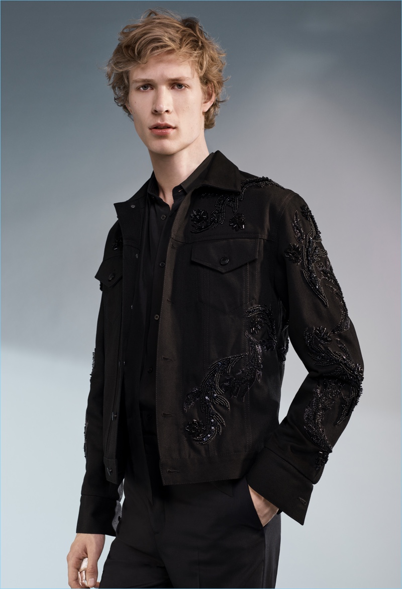 Model Sven de Vries dons a black embellished jacket from H&M's Conscious Exclusive collection.