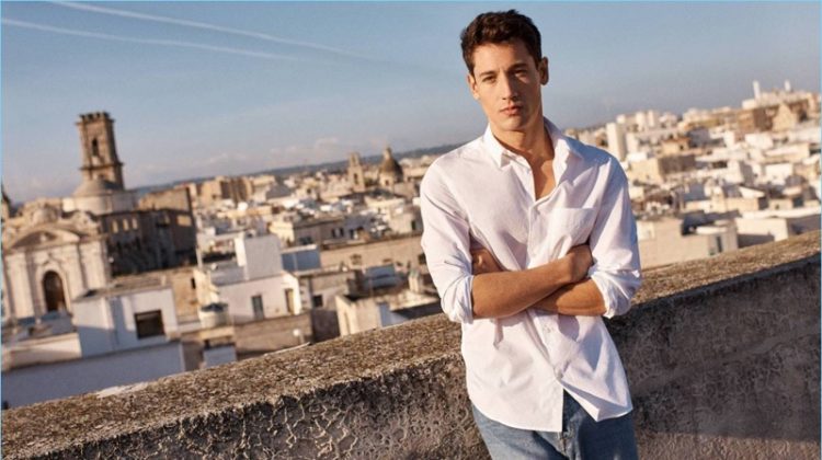 Nicolas Ripoll wears a white pima cotton shirt with relaxed denim jeans by H&M.