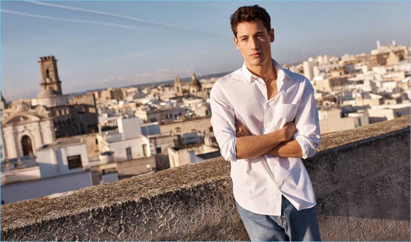 Nicolas Ripoll wears a white pima cotton shirt with relaxed denim jeans by H&M.