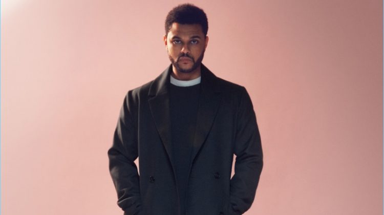 Standing tall, The Weeknd wears a double-breasted coat from H&M.