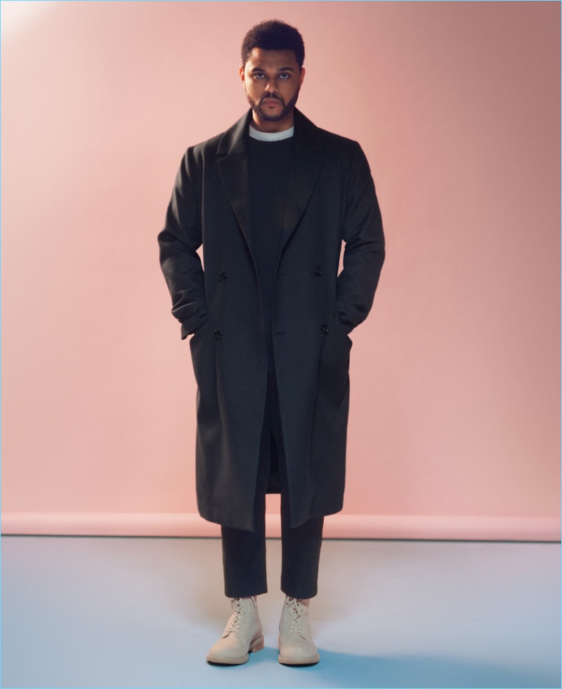 Standing tall, The Weeknd wears a double-breasted coat from H&M.