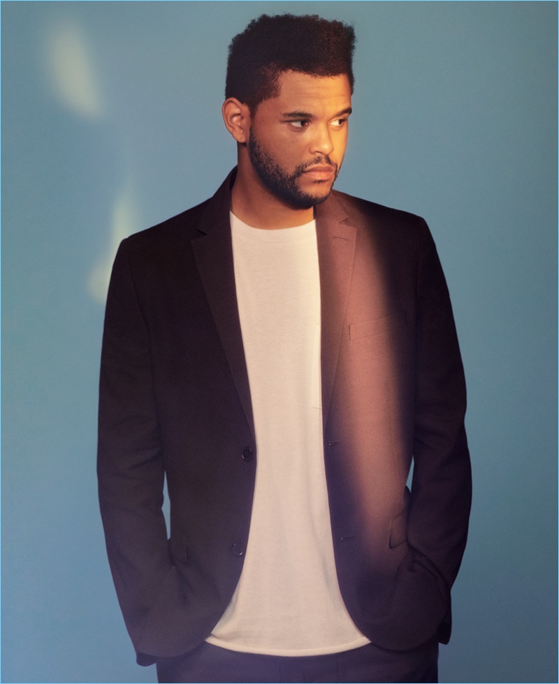 Embracing a clean smart style, The Weeknd wears a blazer with an easy tee.