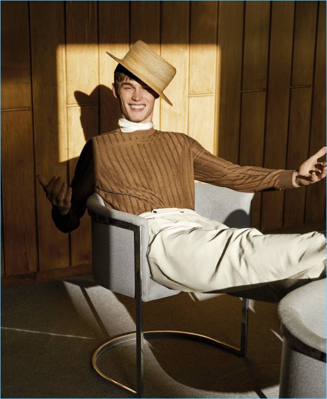 All smiles, Kit Butler wears an elegant look from Ermenegildo Zegna.