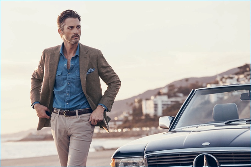 A sleek vision, Ben Hill dons a linen sport coat with AG Graduate pants, a custom brown crocodile leather belt, and a denim shirt.