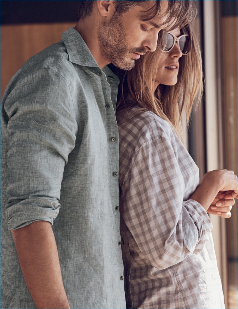 Embracing a moment of leisure, Ben Hill sports a linen shirt by J.Hilburn.