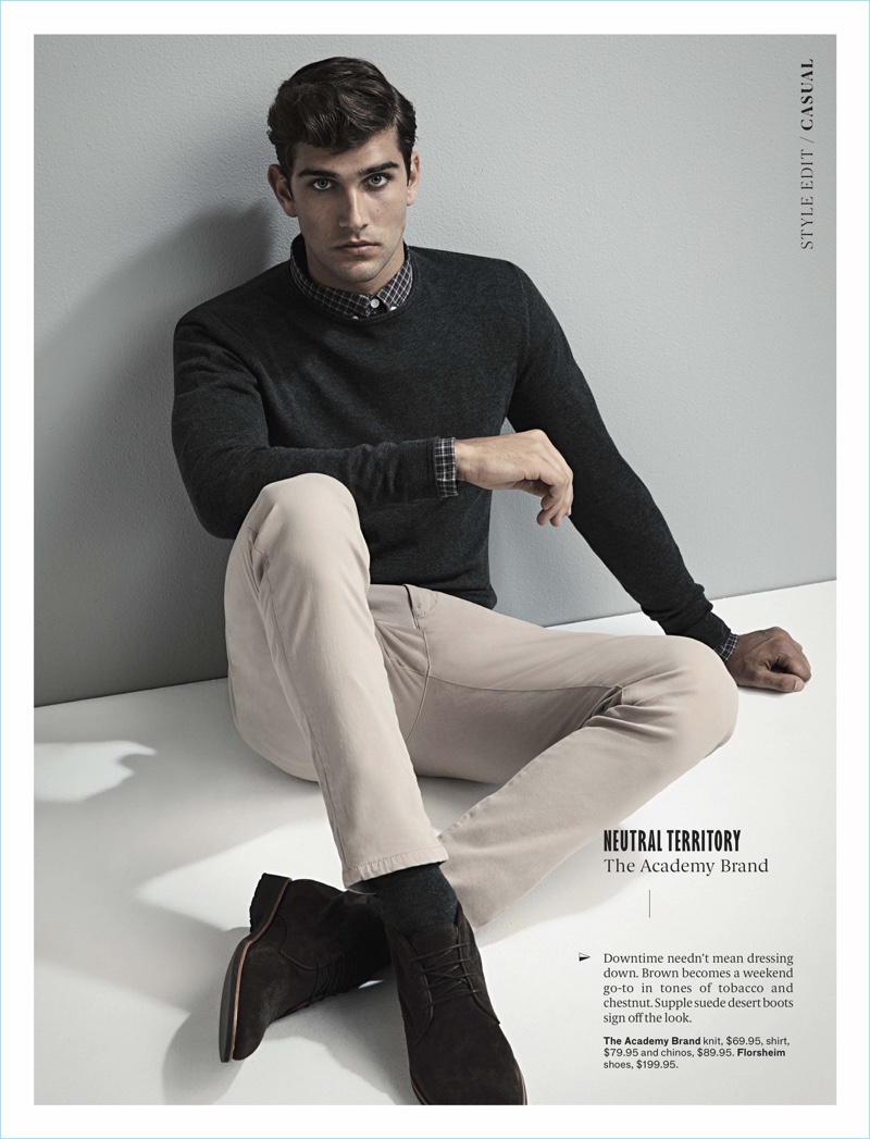 Embracing smart style, Jack Vanderhart wears a sweater, shirt, and chinos by The Academy Brand with Florsheim shoes.