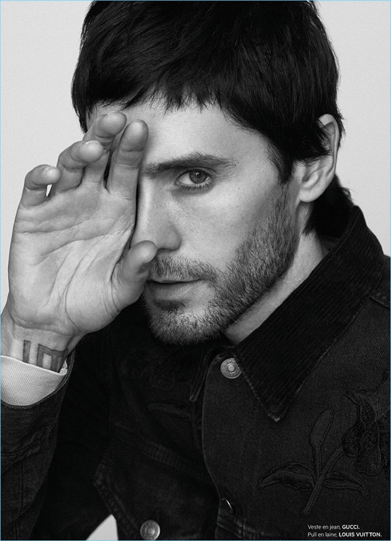 Playing it coy, Jared Leto wears a Gucci denim jacket.