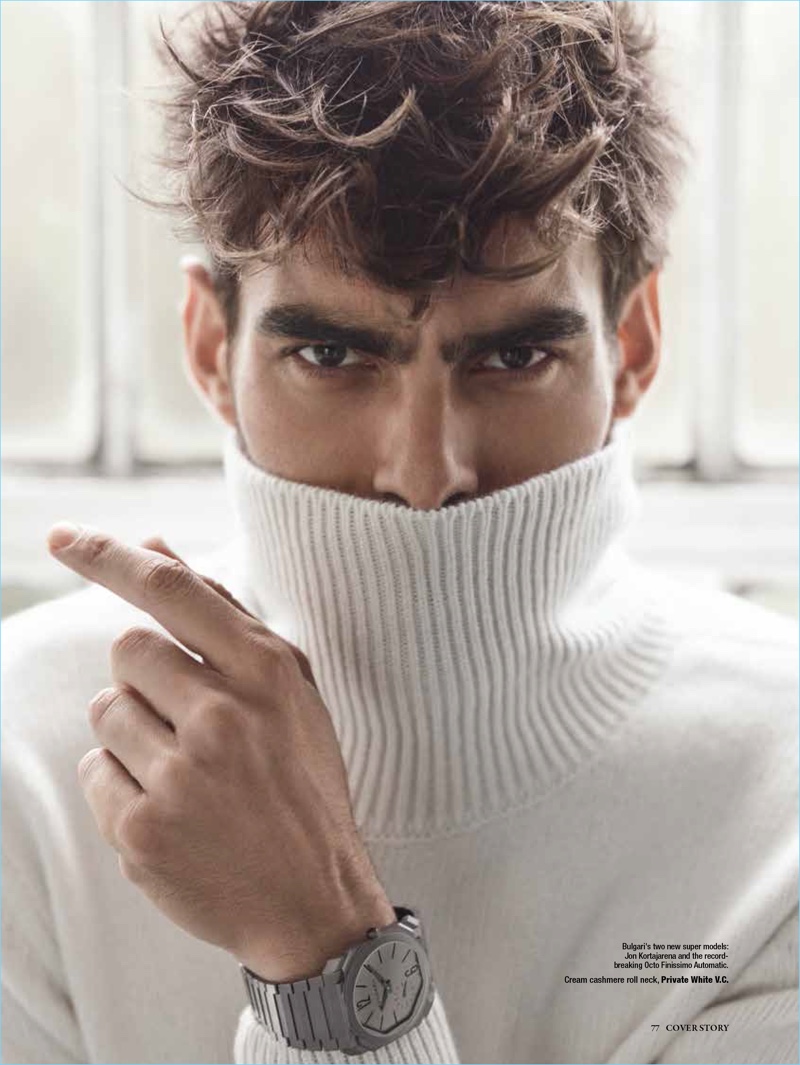 Model Jon Kortajarena wears a cream cashmere turtleneck sweater by Private White V.C.